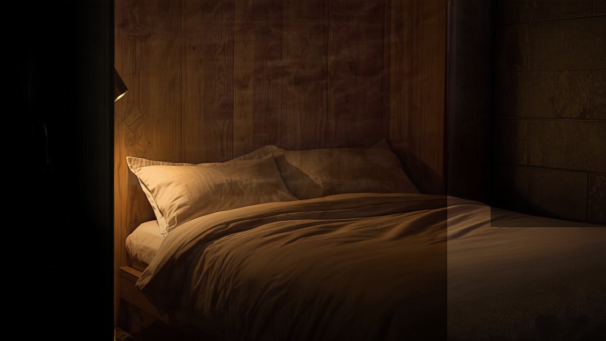 The same room with the Murphy bed folded down, made with white linen