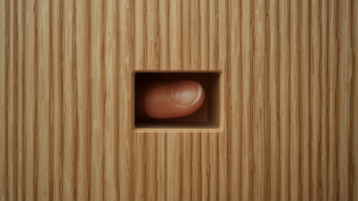 A fingertip opening a handleless cabinet via the shadow gap